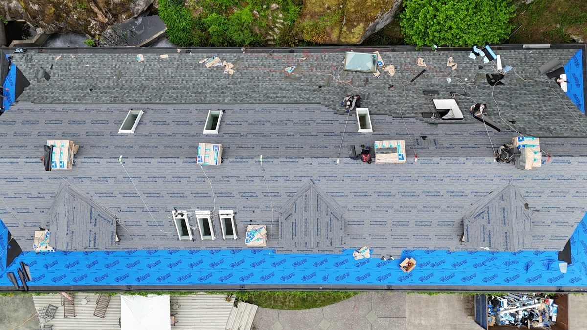 New asphalt shingles over underlayment and starter course