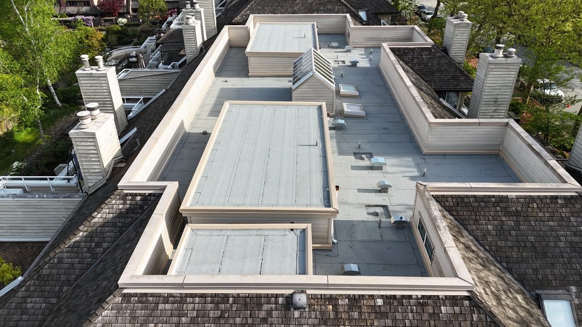 Waterproof membrane over a flat roof section