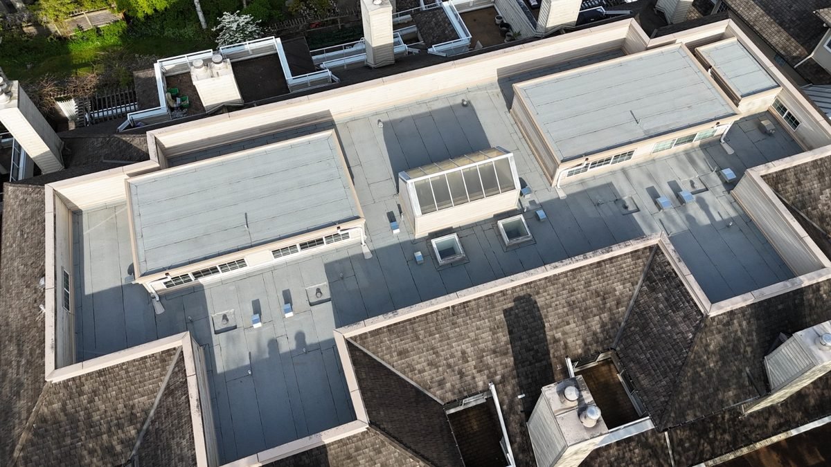 Finished low-slope membrane roof with drainage