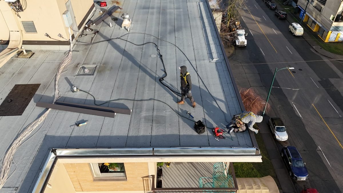 Torch-on membrane work on a low-slope roof