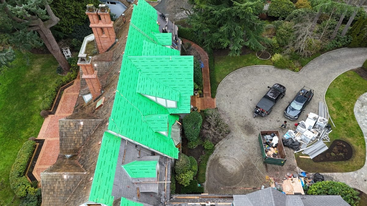 Full re-roof with old roofing removed and the new system going on