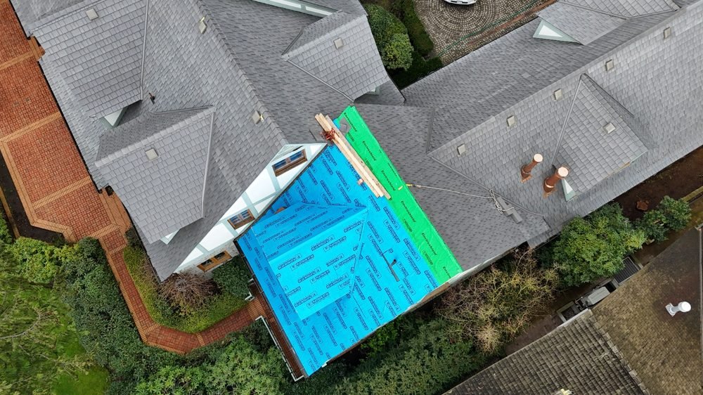 Roof deck prepped and tarped mid-replacement