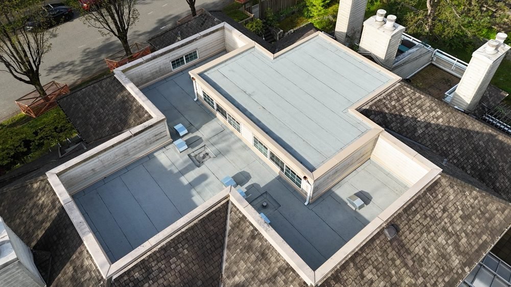 Low-slope membrane roof on a large home