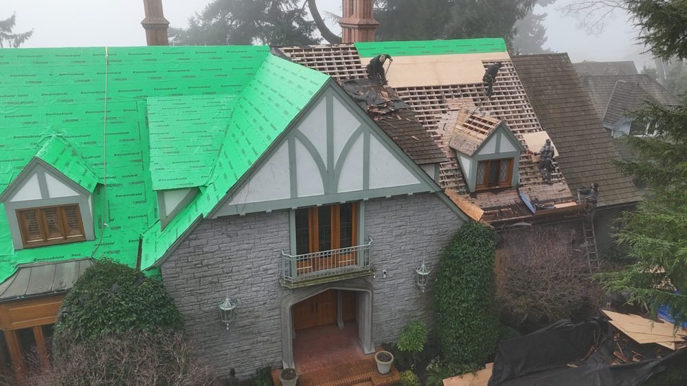 Composite shake going on over an older tile roof