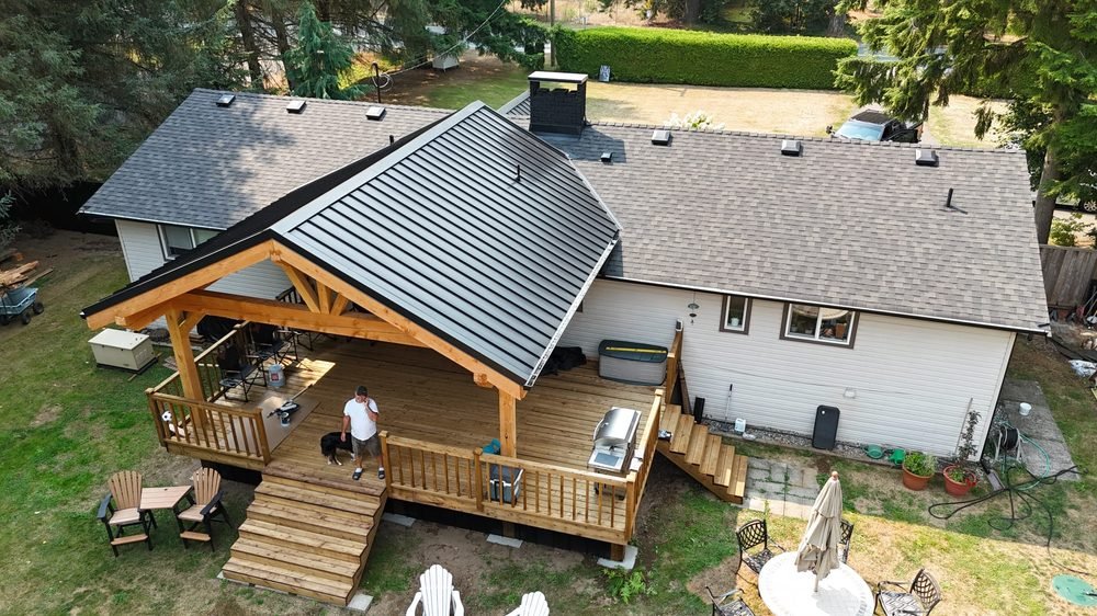Standing-seam metal roof over a cedar deck pavilion